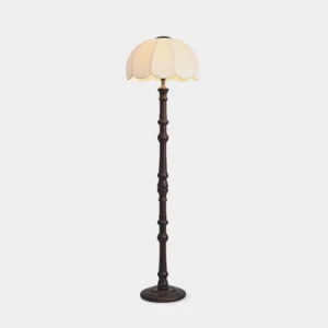 Scalloped vintage floor lamp with carved dark wood stand and round scalloped fabric shade, frontal view on white background