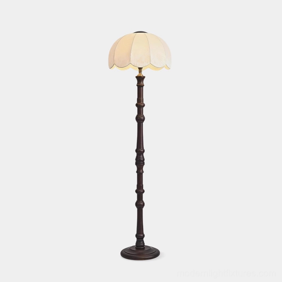 Scalloped vintage floor lamp with carved dark wood stand and round scalloped fabric shade, frontal view on white background