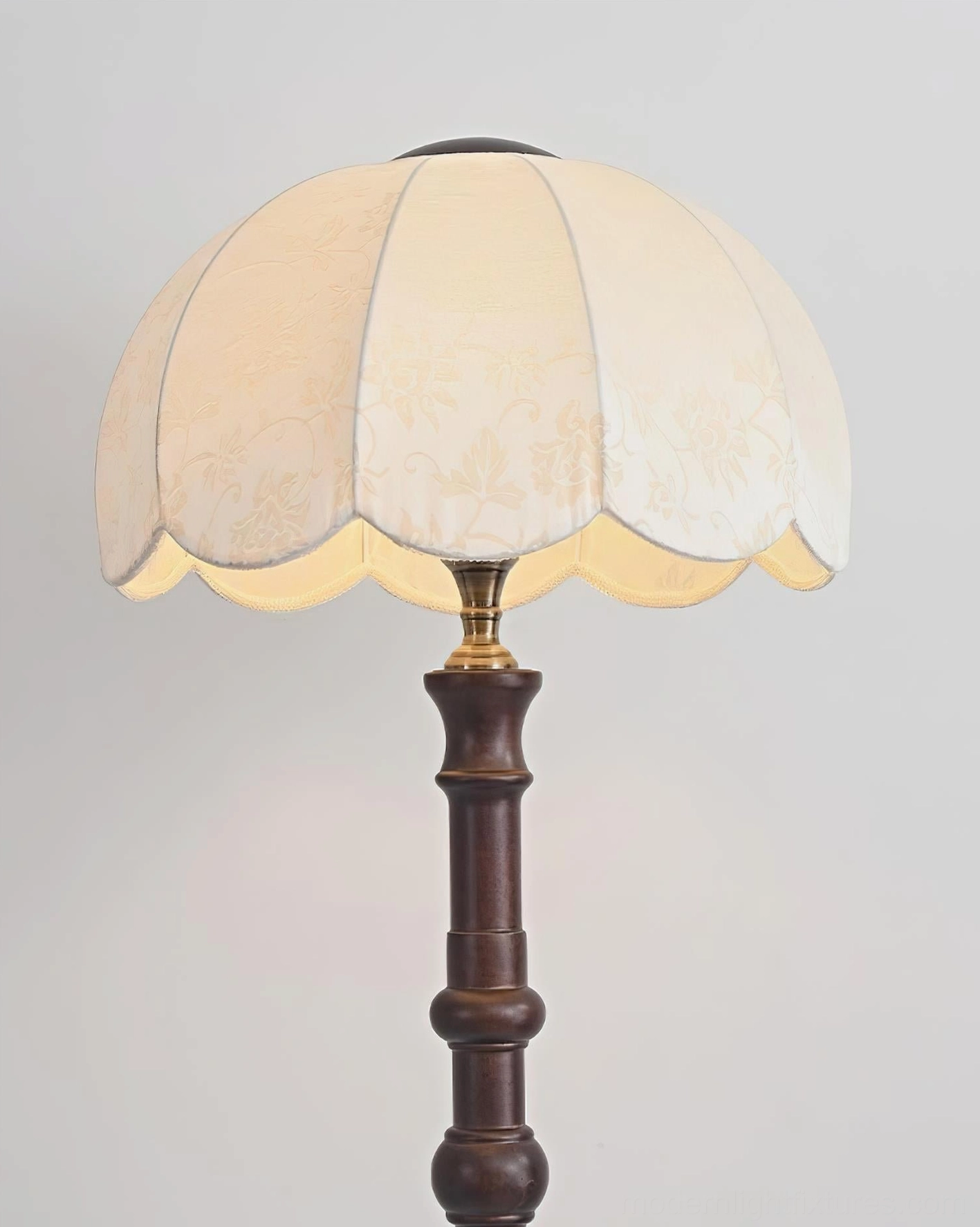 Scalloped vintage floor lamp showing fabric shade construction and warm light diffusion effect