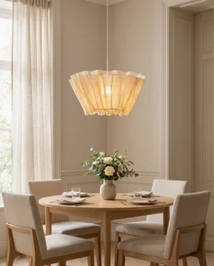 Scallora pendant light hanging over dining table in minimalist dining room, soft warm ambient glow from single E27 bulb, eye-level view
