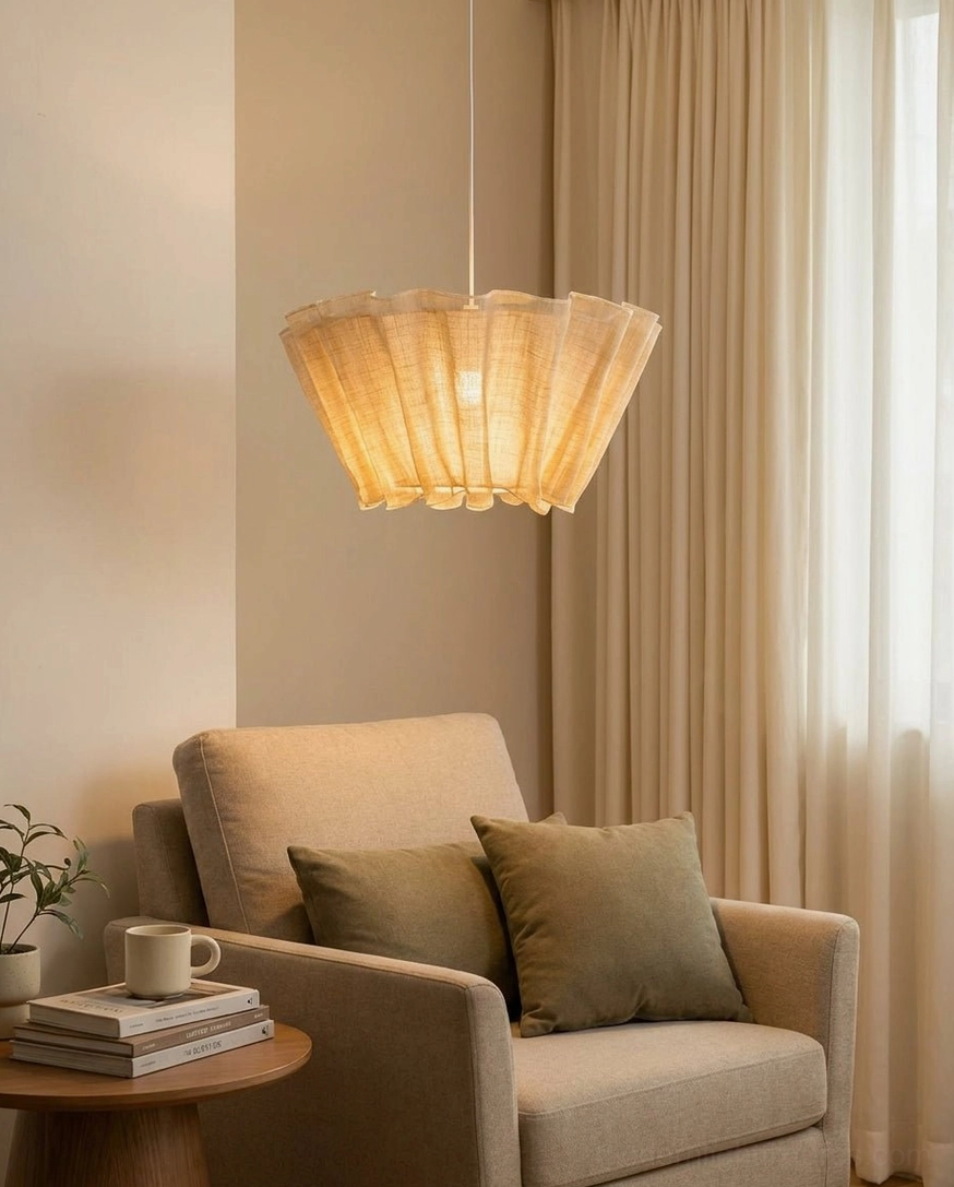 Scallora woven fiber pendant light side profile in living room lounge area with beige armchair and wabi-sabi decor styling