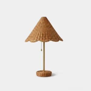 Scalora scalloped woven rattan table lamp with brass metal stem, front studio view on white background
