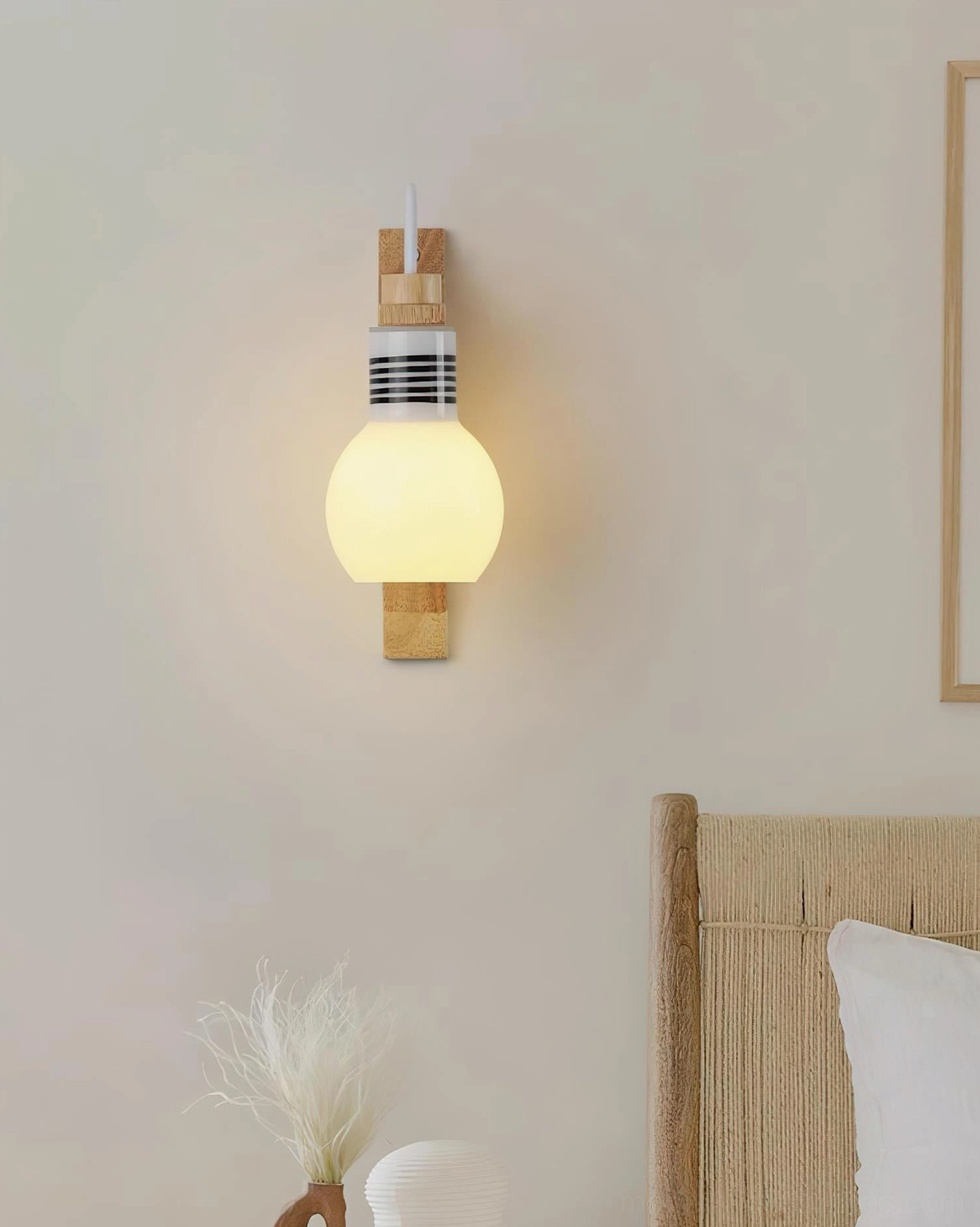 Scandinavian style globe wall sconce with wooden headboard backdrop, contemporary bedroom design