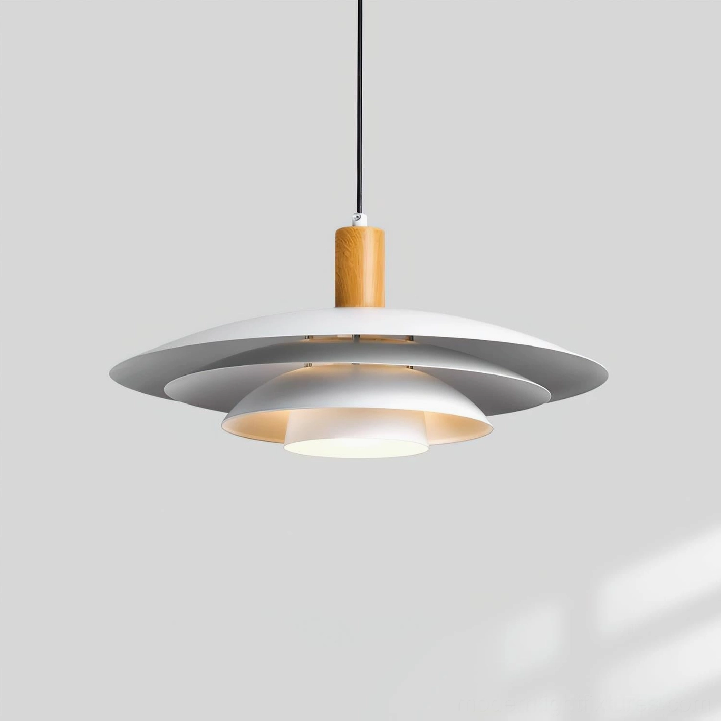 Scandinavian modern pendant lamp three-quarter angle showing matte white and silver metal shades with wood grain joint detail