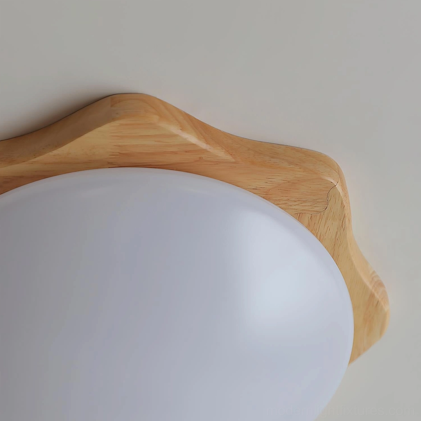 Modern organic maple wood ceiling light in Scandinavian inspired interior with minimalist aesthetic and neutral tones