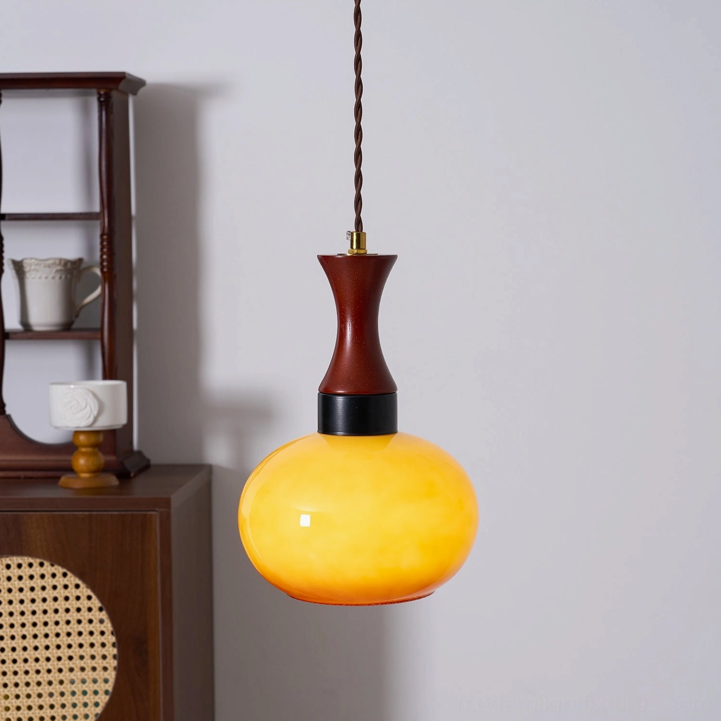 Modern hanging pendant lamp in Scandinavian design aesthetic with warm glass tones