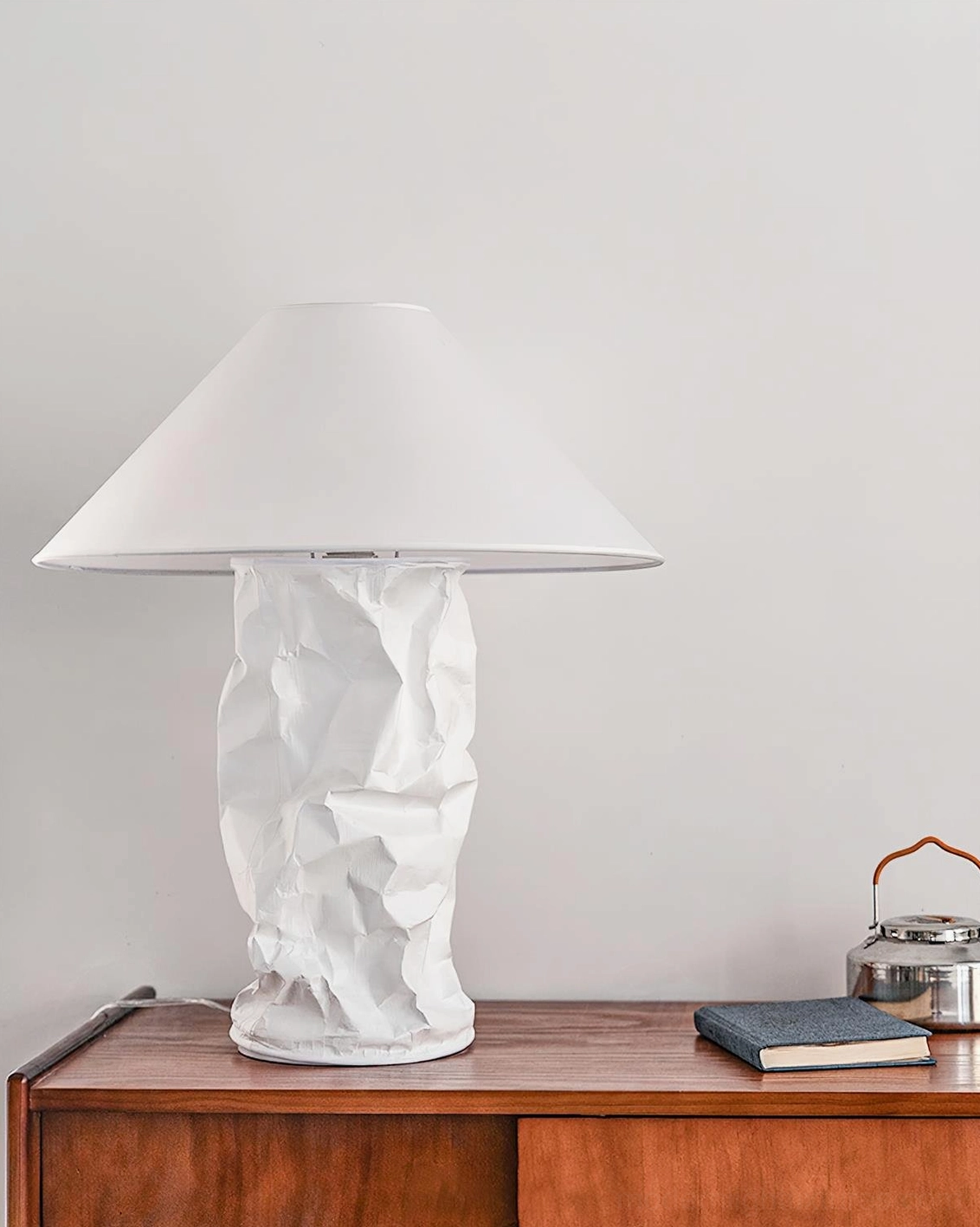 Scandinavian inspired table lamp with minimalist design in neutral bedroom setting