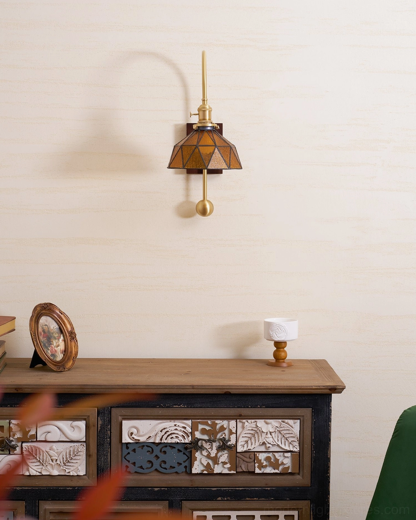 Scandinavian-style wall sconce with natural wood tones and functional brass design
