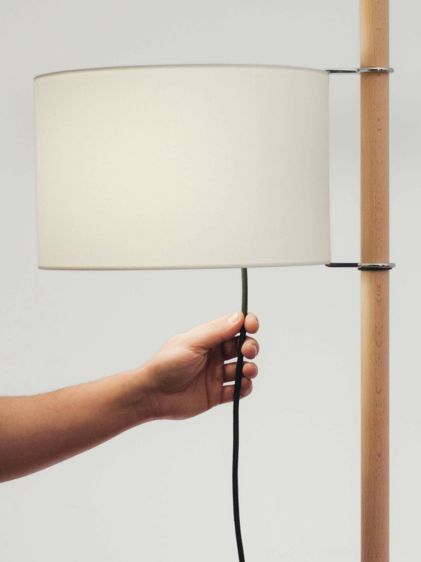 Scandinavian wooden floor lamp with minimalist design and functional cross base support