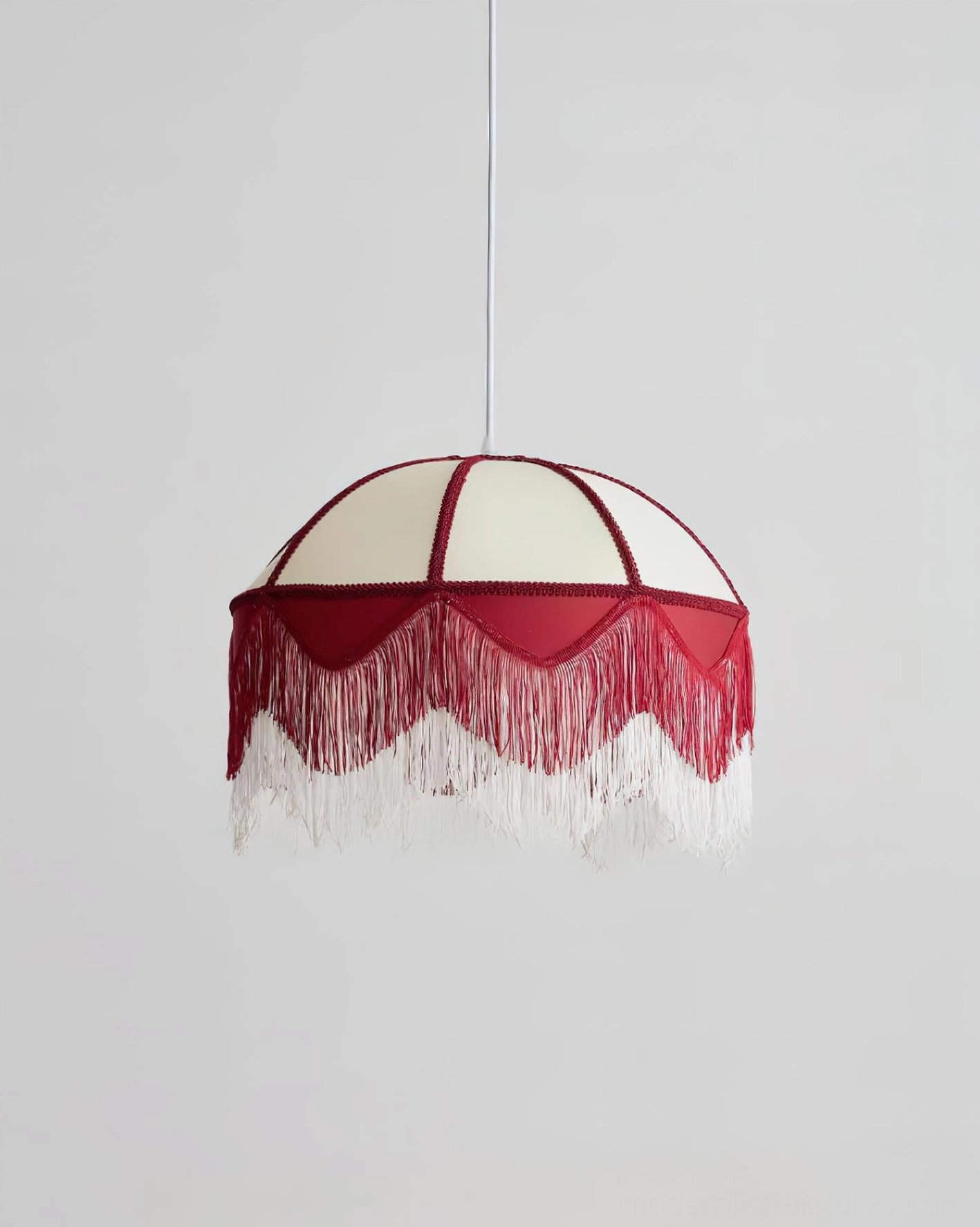 Close-up detail of Scarlet Fringe Pendant Lamp showing scalloped burgundy edge and white tassel fringe