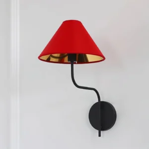 Contemporary black metal wall sconce with scarlet red fabric shade and decorative wall trim