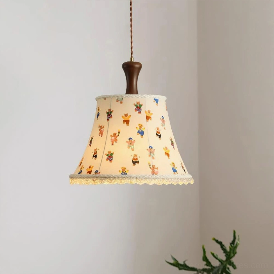 Colorful striped fabric pendant lamp with lace trim in modern interior with green plant decor and warm ambient lighting