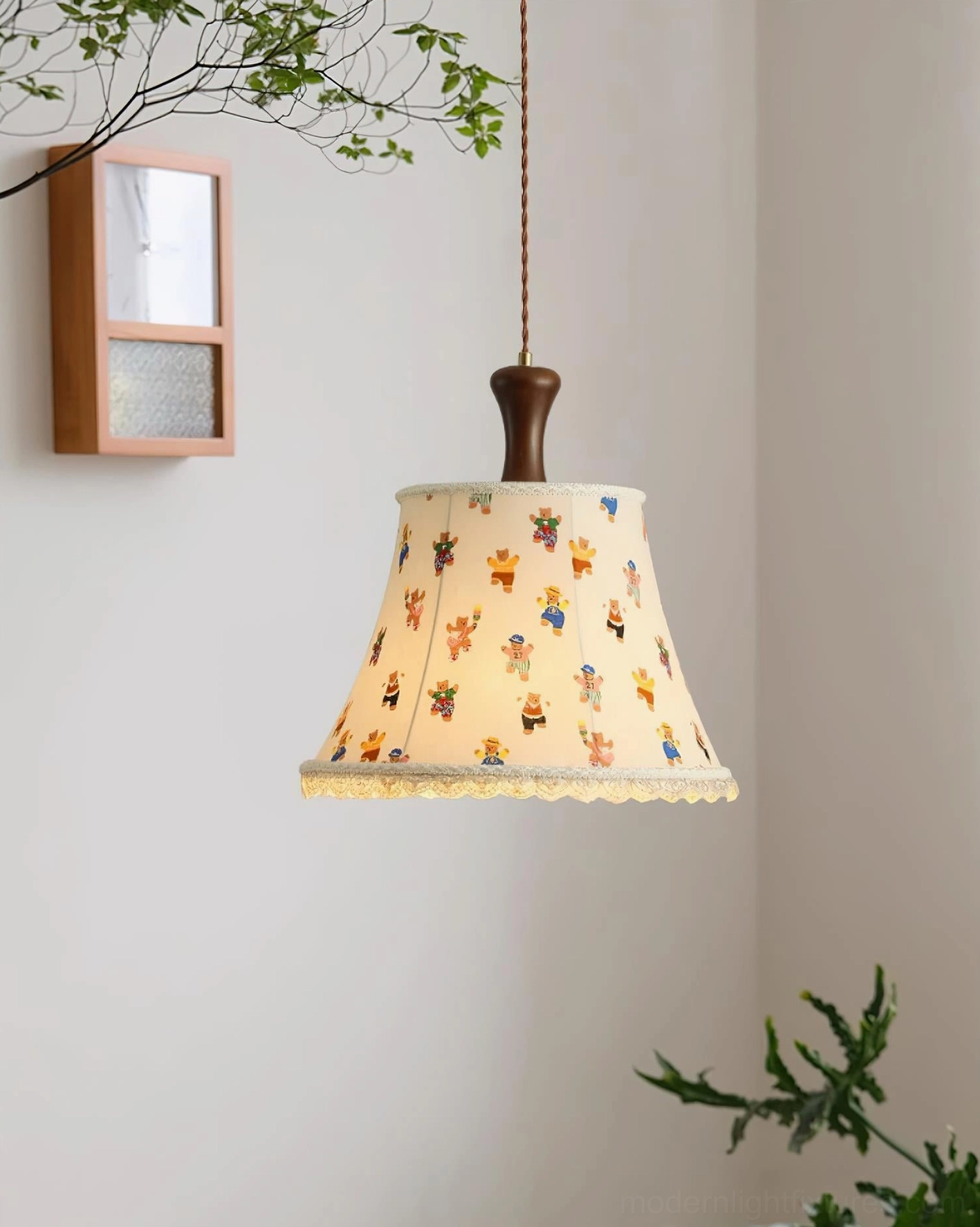 Hand-drawn bear print fabric pendant lamp with warm lighting in cozy bedroom with wooden shelving