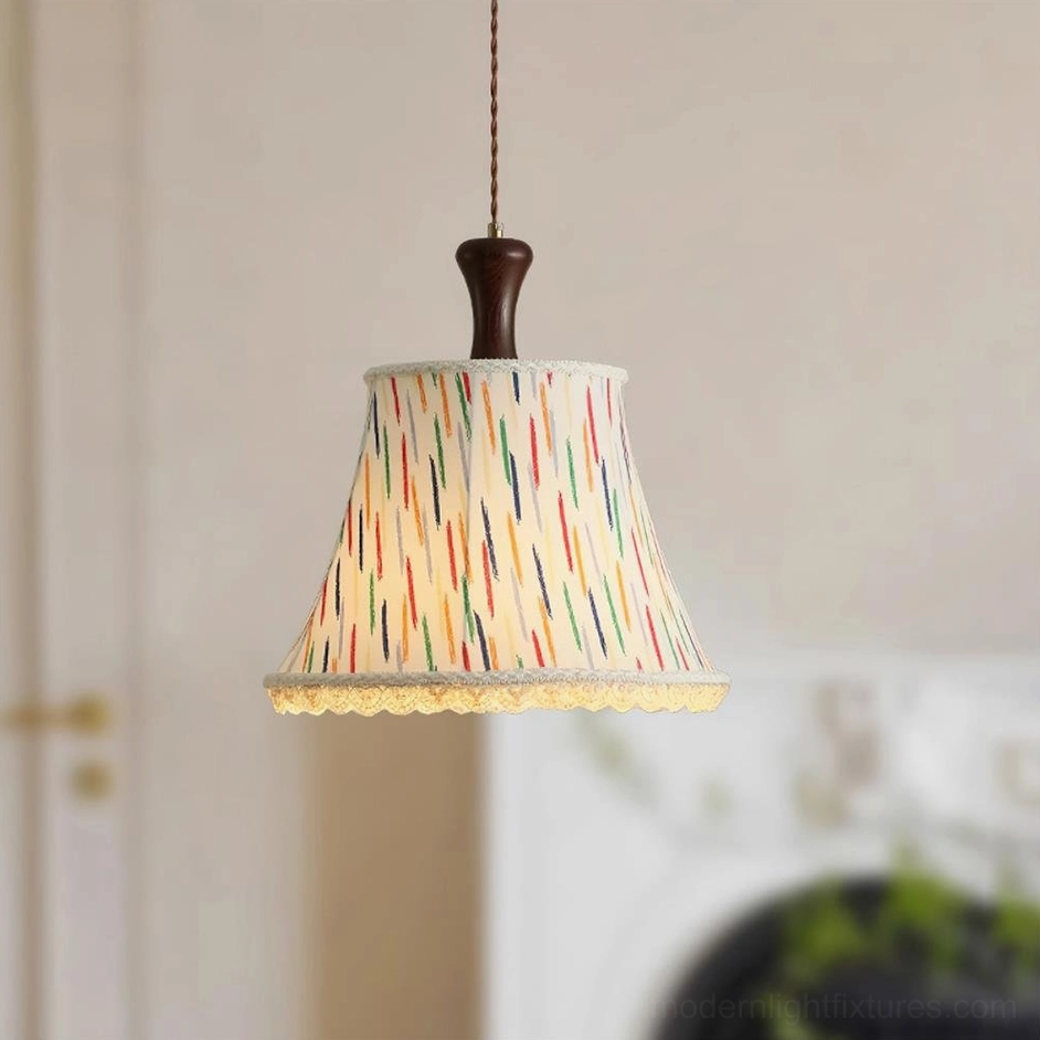 Scotia pendant light with multicolor vertical stripe pattern and lace trim detail near fireplace