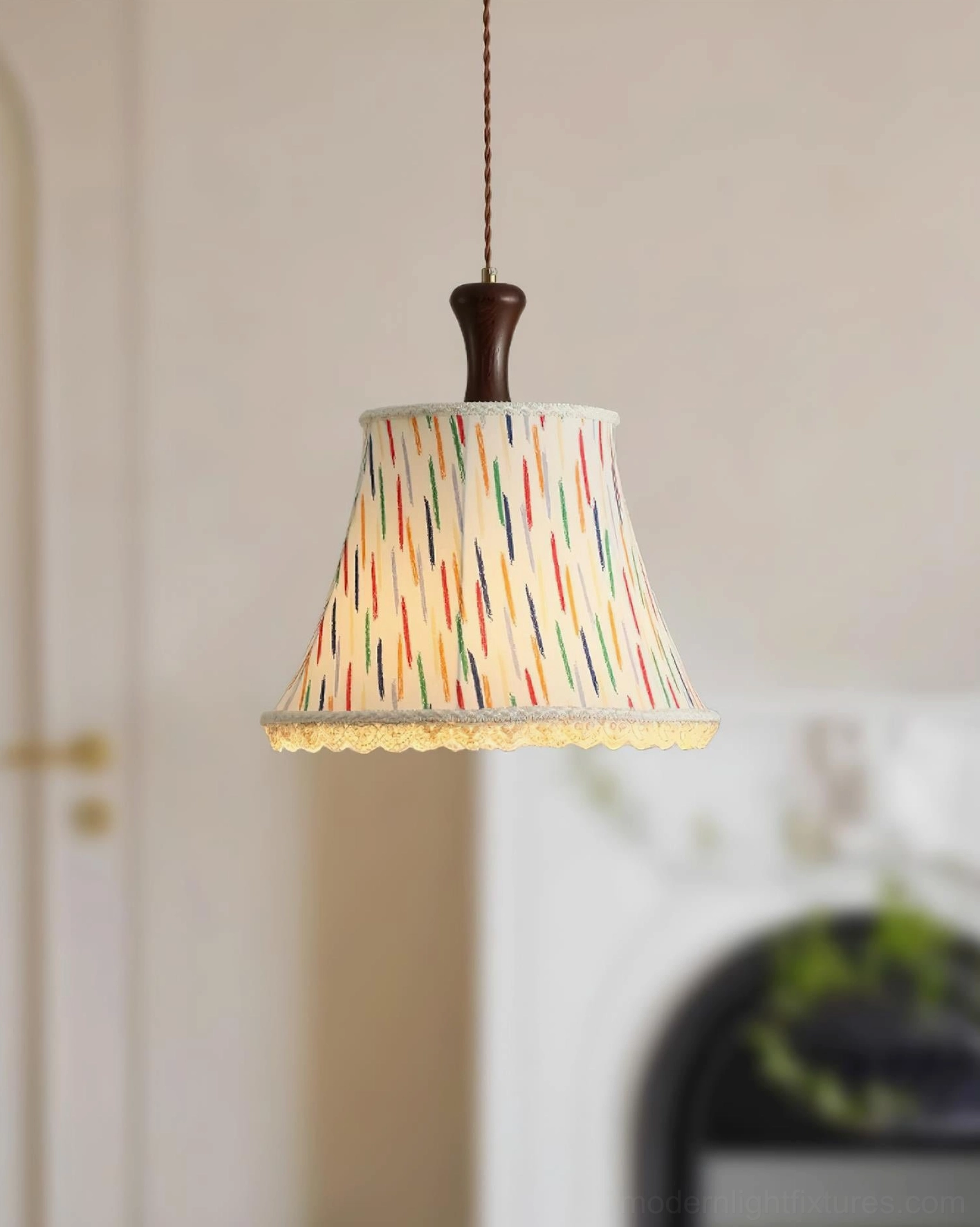 Hand-drawn striped fabric pendant light fixture with warm white illumination in contemporary living room