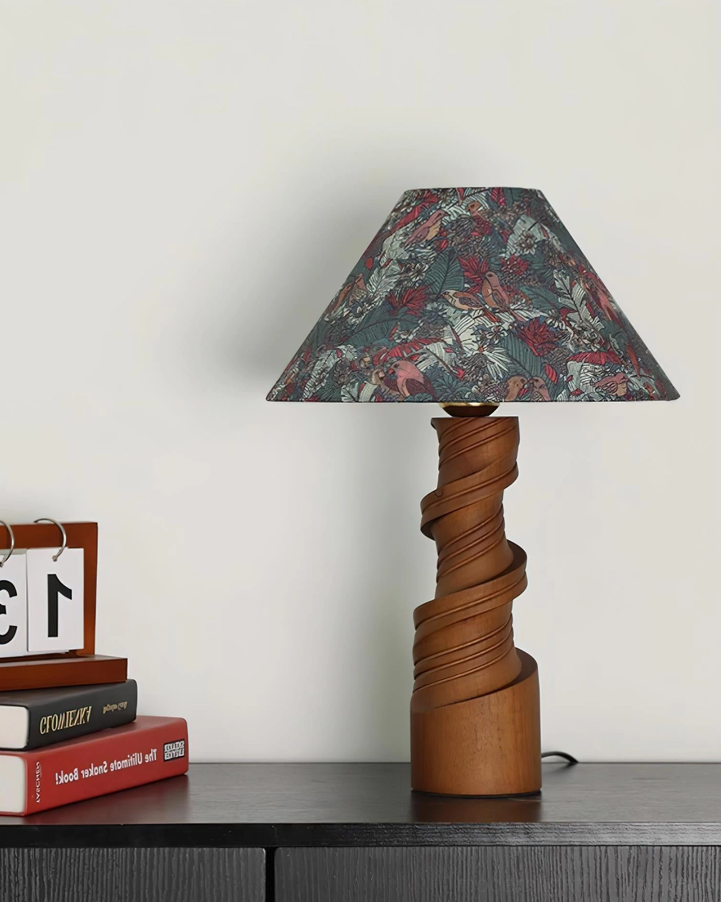Scrollroot table lamp ambient lighting mood shot on bedroom nightstand with warm glow and decor