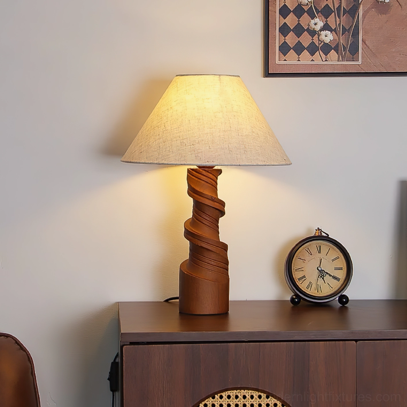 Scrollroot table lamp with twisted wood base illuminated on living room cabinet, paired with desk clock decor