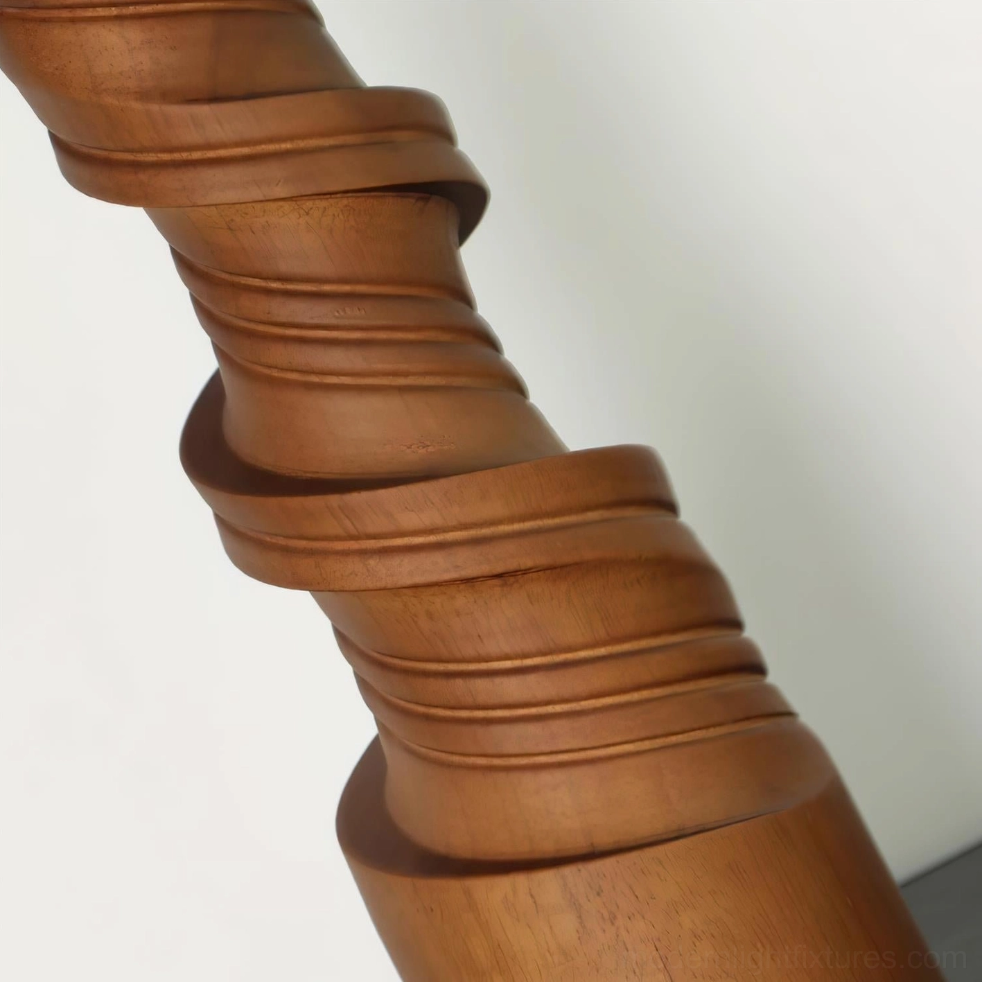 Scrollroot table lamp on office desk with twisted wood base providing task and accent lighting