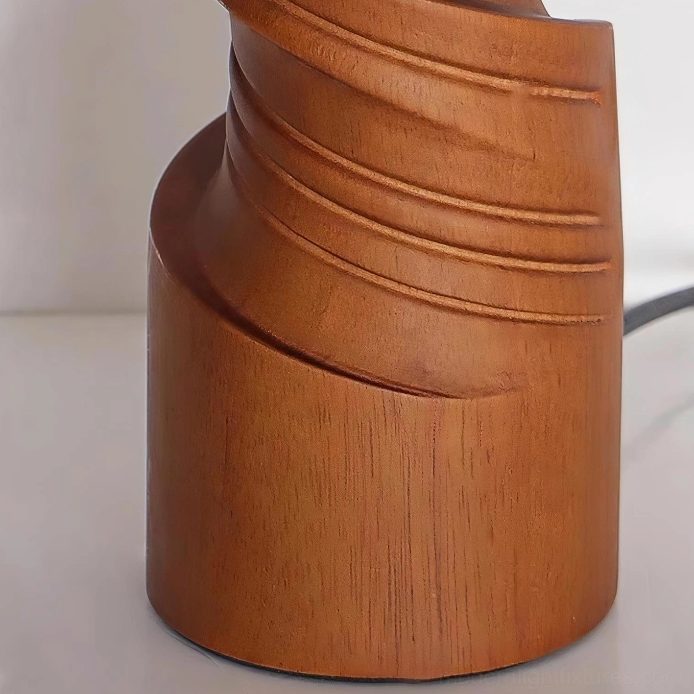 Scrollroot table lamp showing fabric shade texture and wood base craftsmanship detail photography
