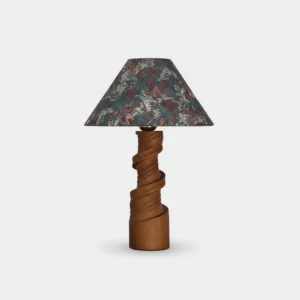 Scrollroot sculptural table lamp with twisted solid wood base and floral conical fabric shade in walnut finish, studio front view
