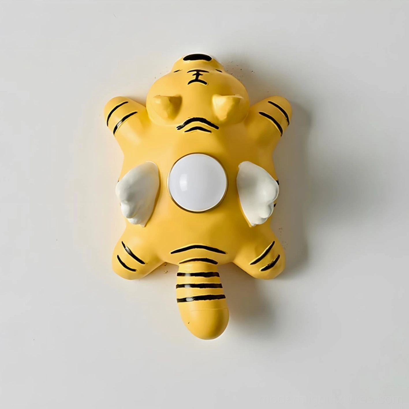 Sculptural animal wall lamp with rounded contours and soft color blocking design
