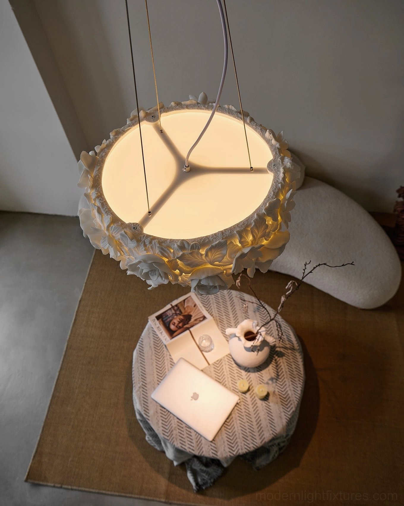 Sculptural ceramic flower pendant light with dimensional botanical details, showcasing artisanal craftsmanship and design