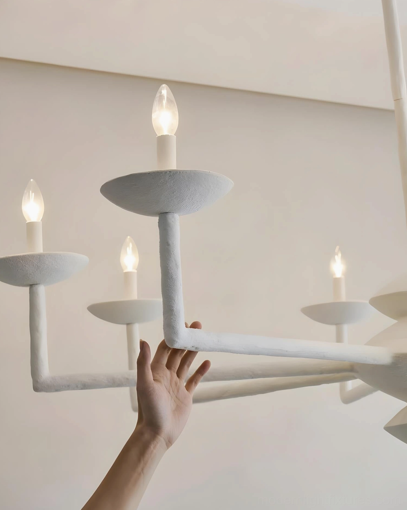 Modern sculptural chandelier ambient lighting effect, artistic light and shadow interplay