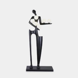 Modern sculptural floor lamp with humanoid figure and illuminated frosted glass orbs, matte black finish on white studio background