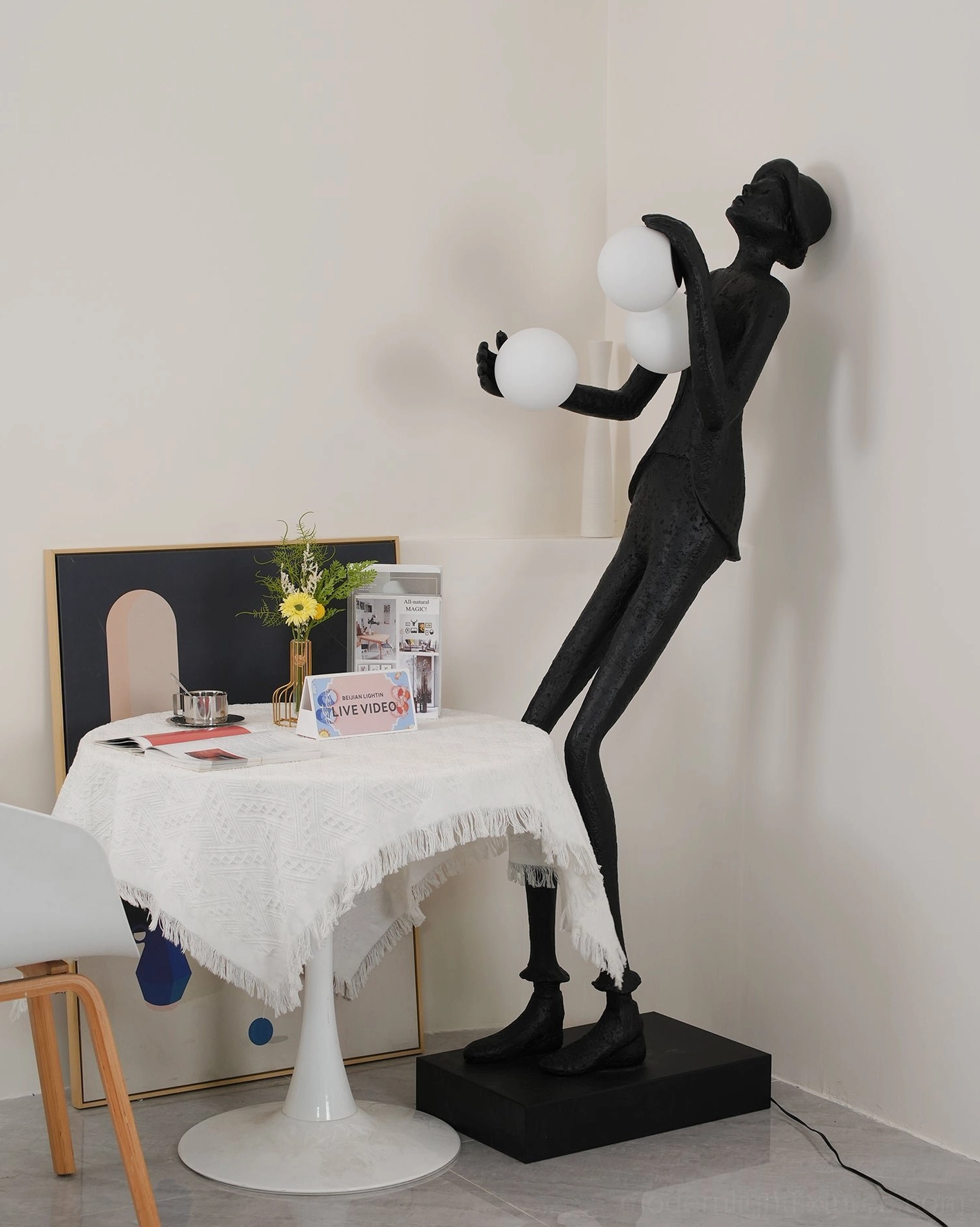 Sculptural floor lamp humanoid resin body frosted glass orbs contemporary interior design lighting