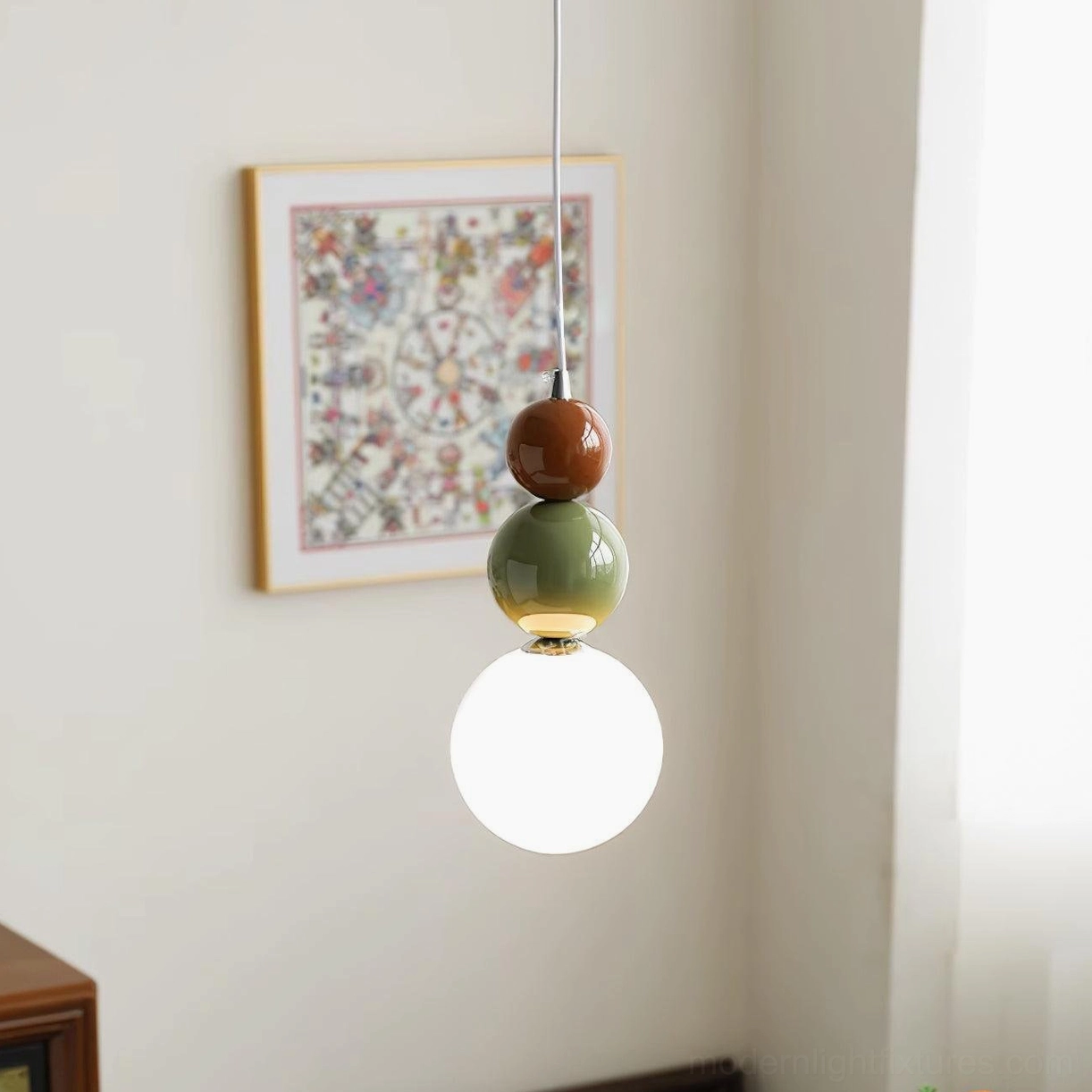 Three-sphere glass ball pendant lamp close-up of sculptural geometric form