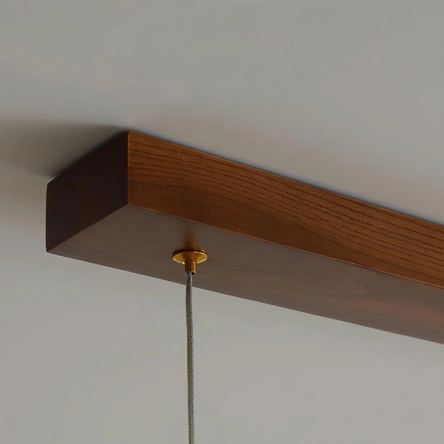 Contemporary linear LED chandelier with geometric wood frame creating sculptural silhouette in studio lighting