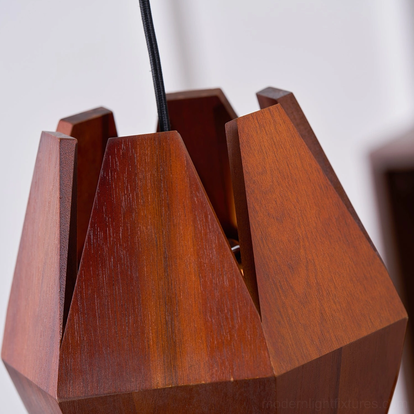 Sculptural geometric wood pendant lamp as statement lighting in modern home setting
