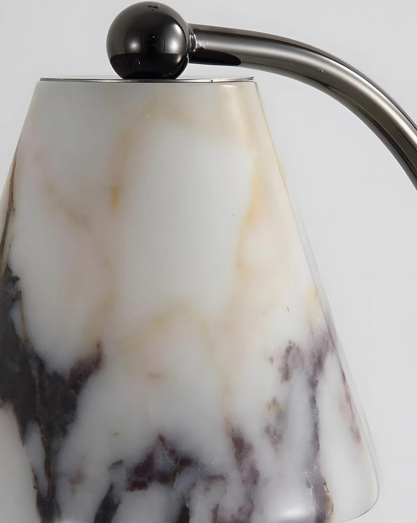 Contemporary marble candle warmer lamp showcasing organic veining and sculptural form