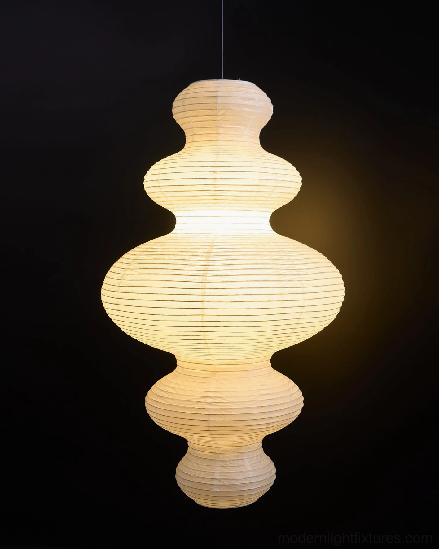 Modern sculptural pendant light aging gracefully with durable bamboo silk frame longevity performance