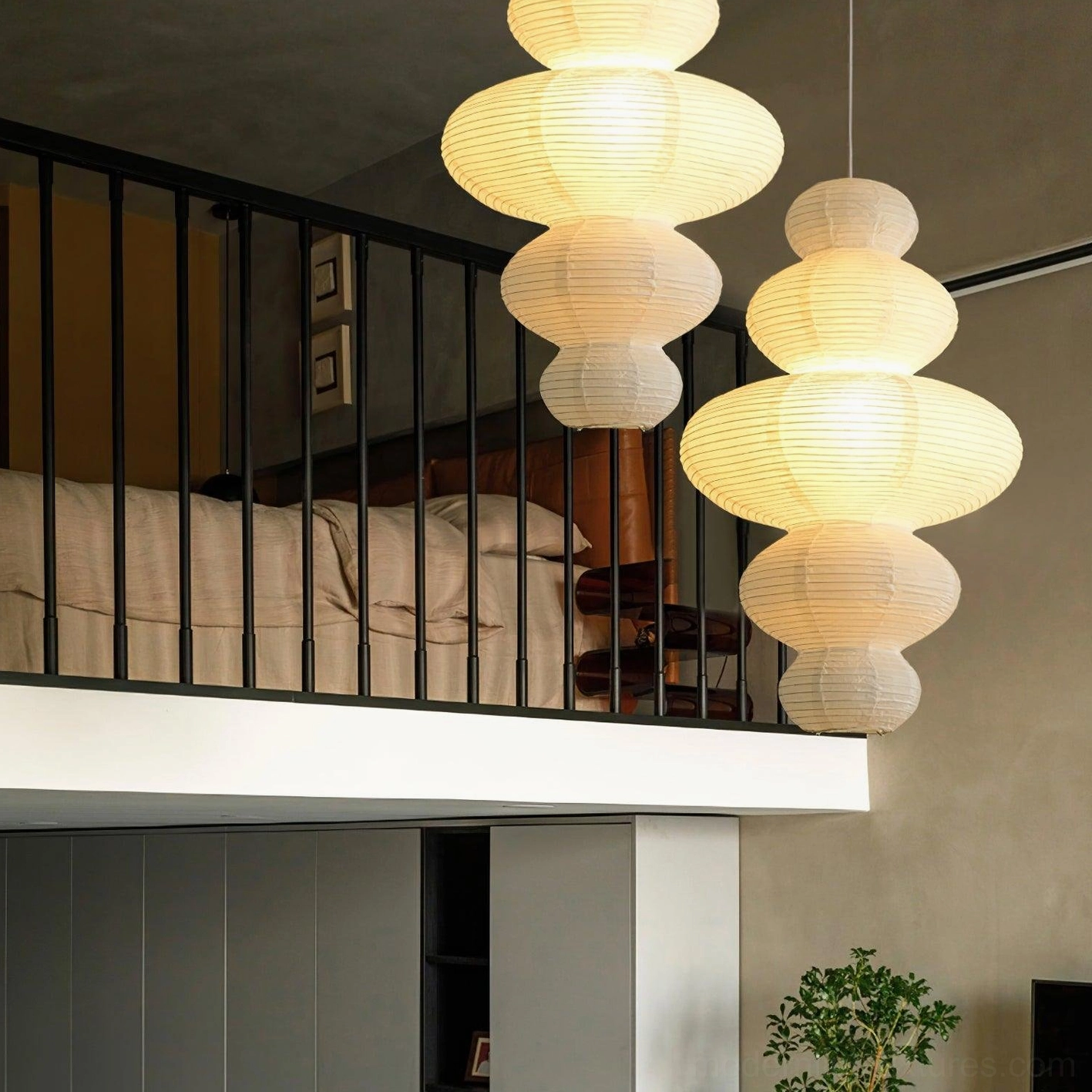 Sculptural white pendant light pair creating dual focal points in contemporary home interior