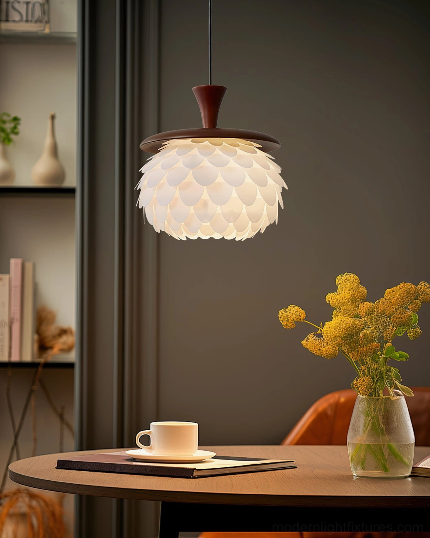 Petal pendant ceiling light in cozy apartment dining nook with round wooden table and warm home decor styling