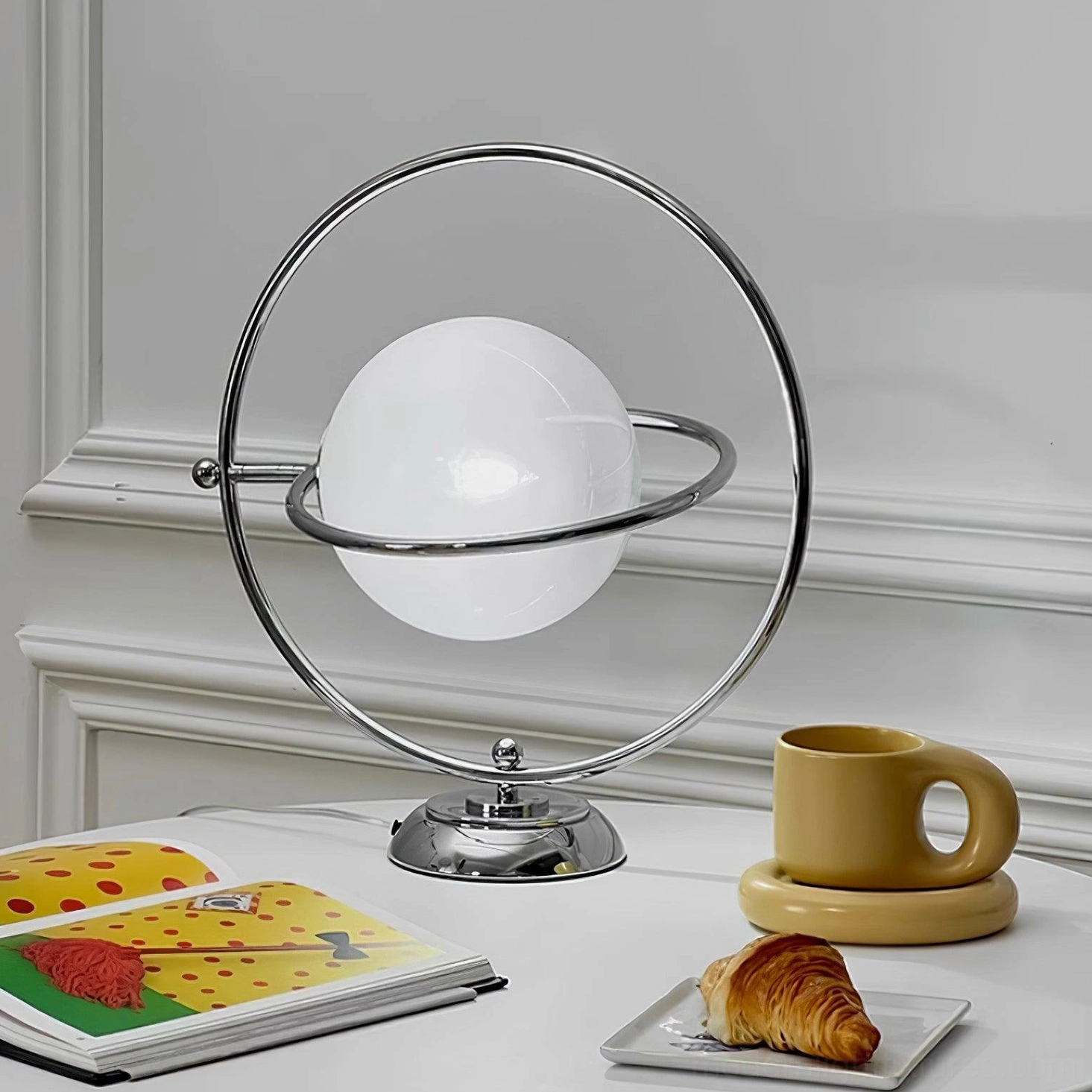 Sculptural rotating globe table lamp artistic presentation modern lighting