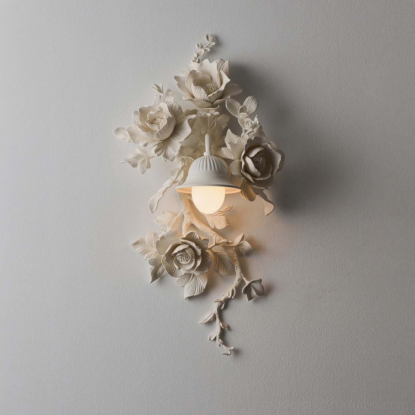 Elysia Bloom sculptural floral wall sconce, close-up detail of gypsum-resin carved roses and leaf relief texture