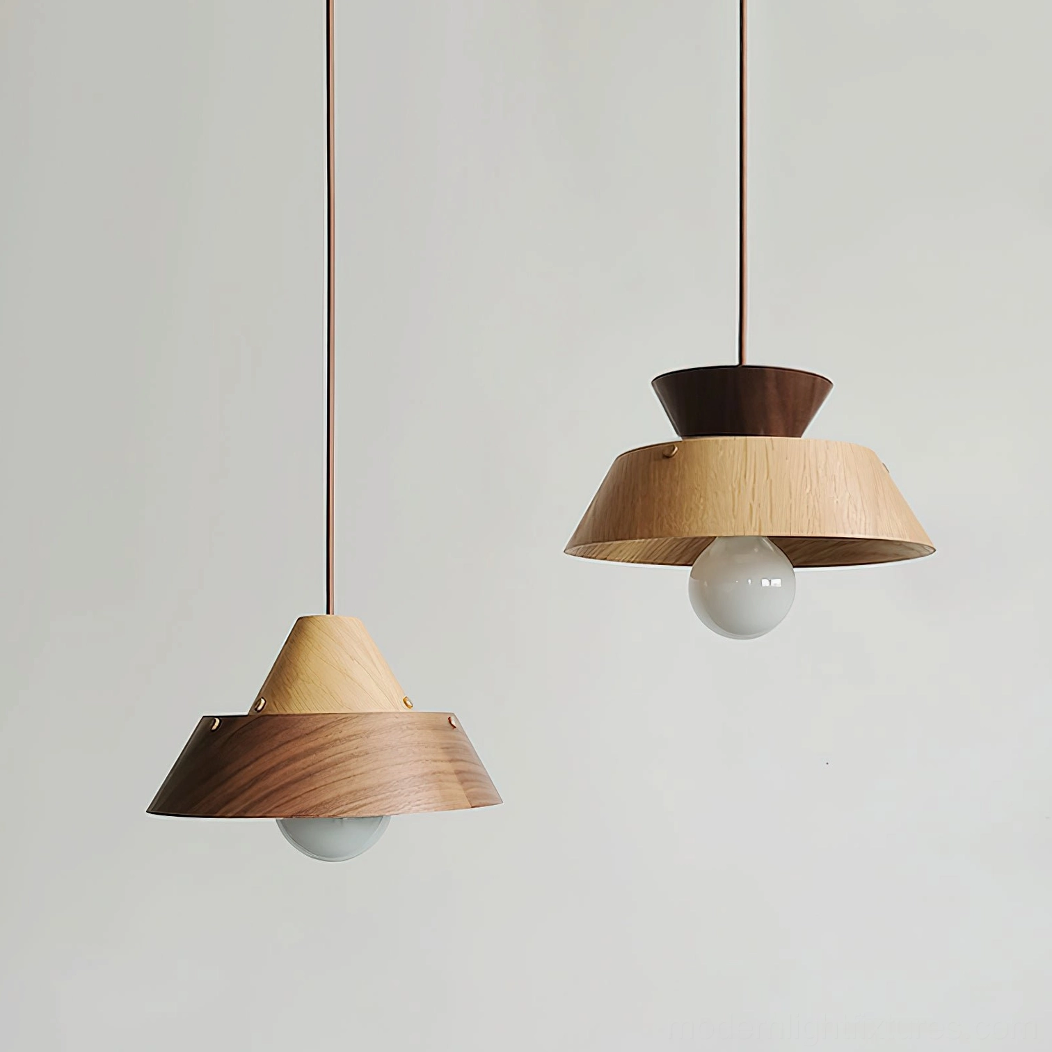 Tiered pendant light showing sculptural architectural form and light diffusion through layered wood shade