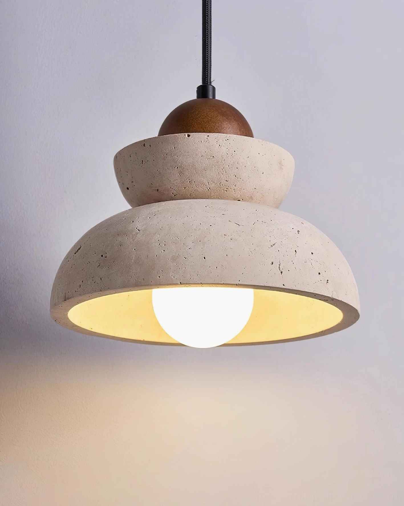 Modern travertine pendant light sculptural form minimalist interior design element