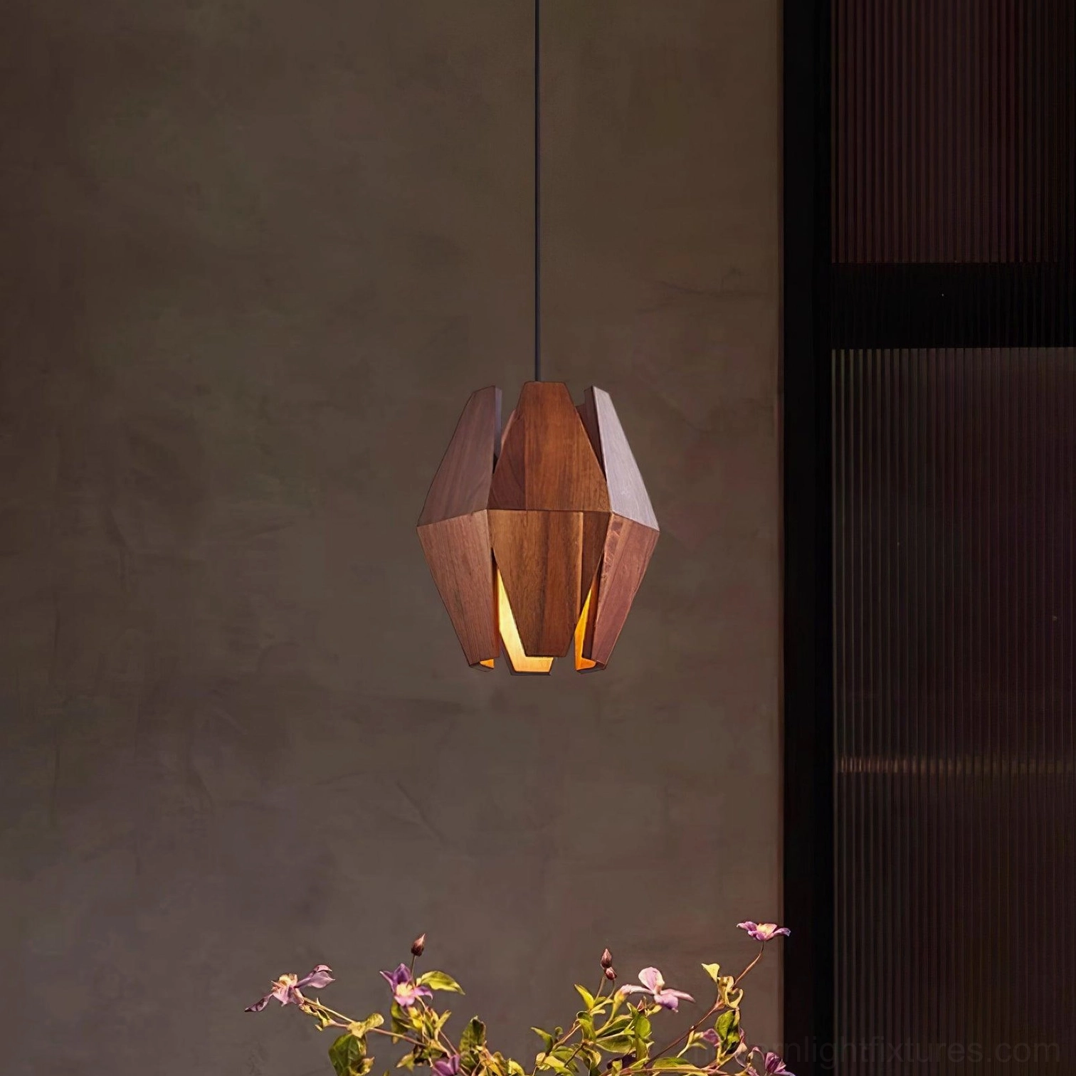 Sculptural walnut pendant lamp demonstrating artistic design and functional illumination