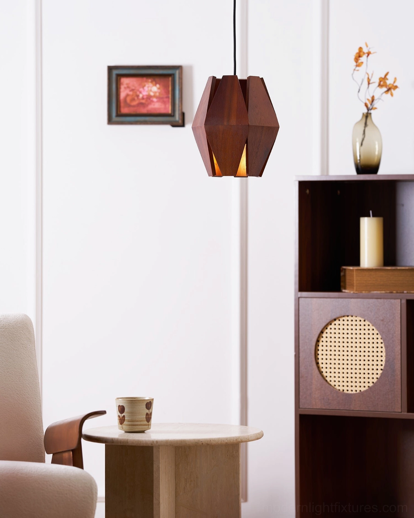 Modern wood pendant fixture creating sculptural visual interest in minimalist room