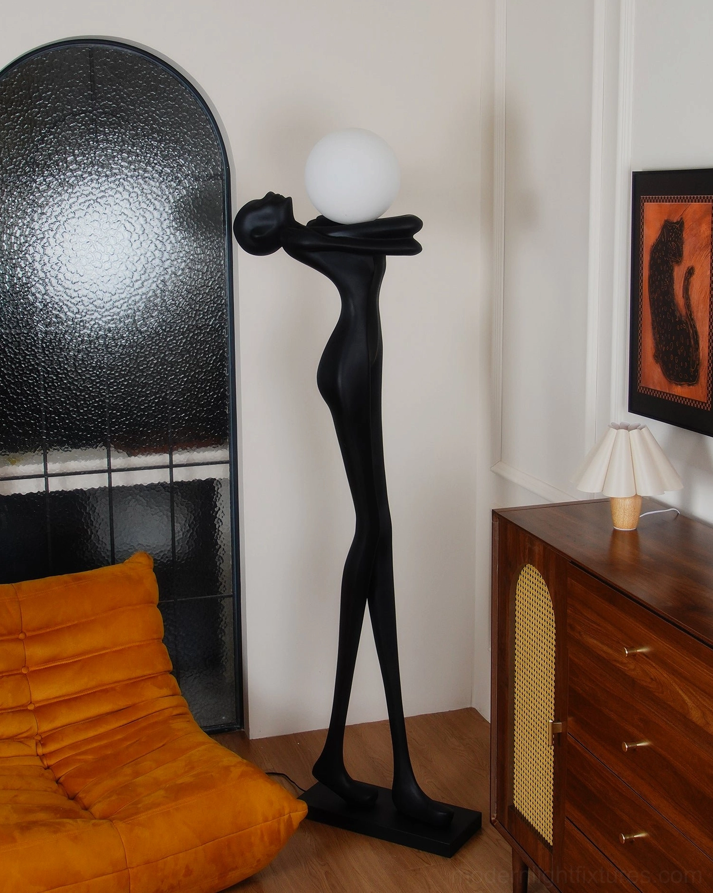 Minimalist black sculpture floor lamp bedroom setting, arched accent wall background, artistic design lighting