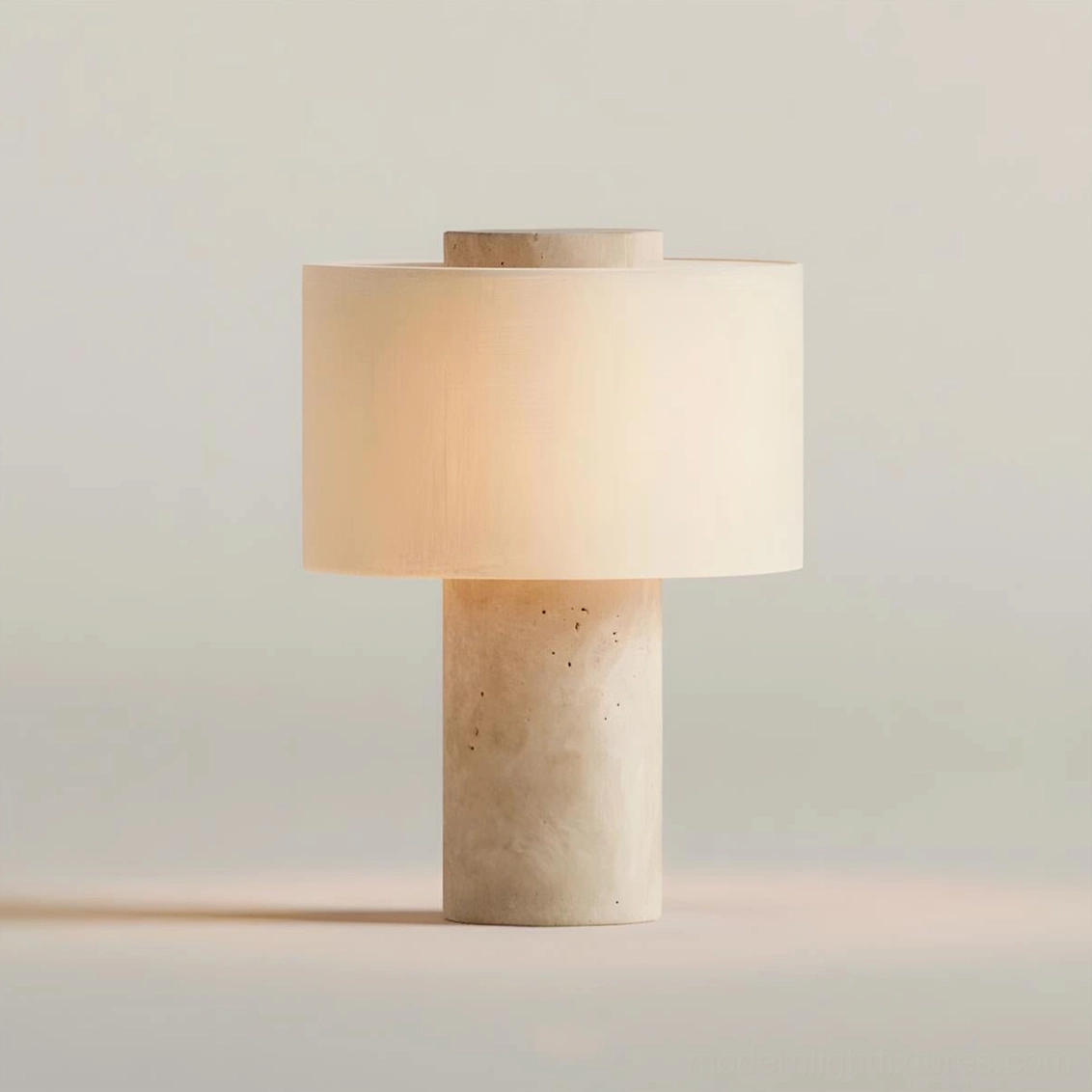 Beige travertine Sediment table lamp with warm ambient lighting on studio background showcasing natural stone texture