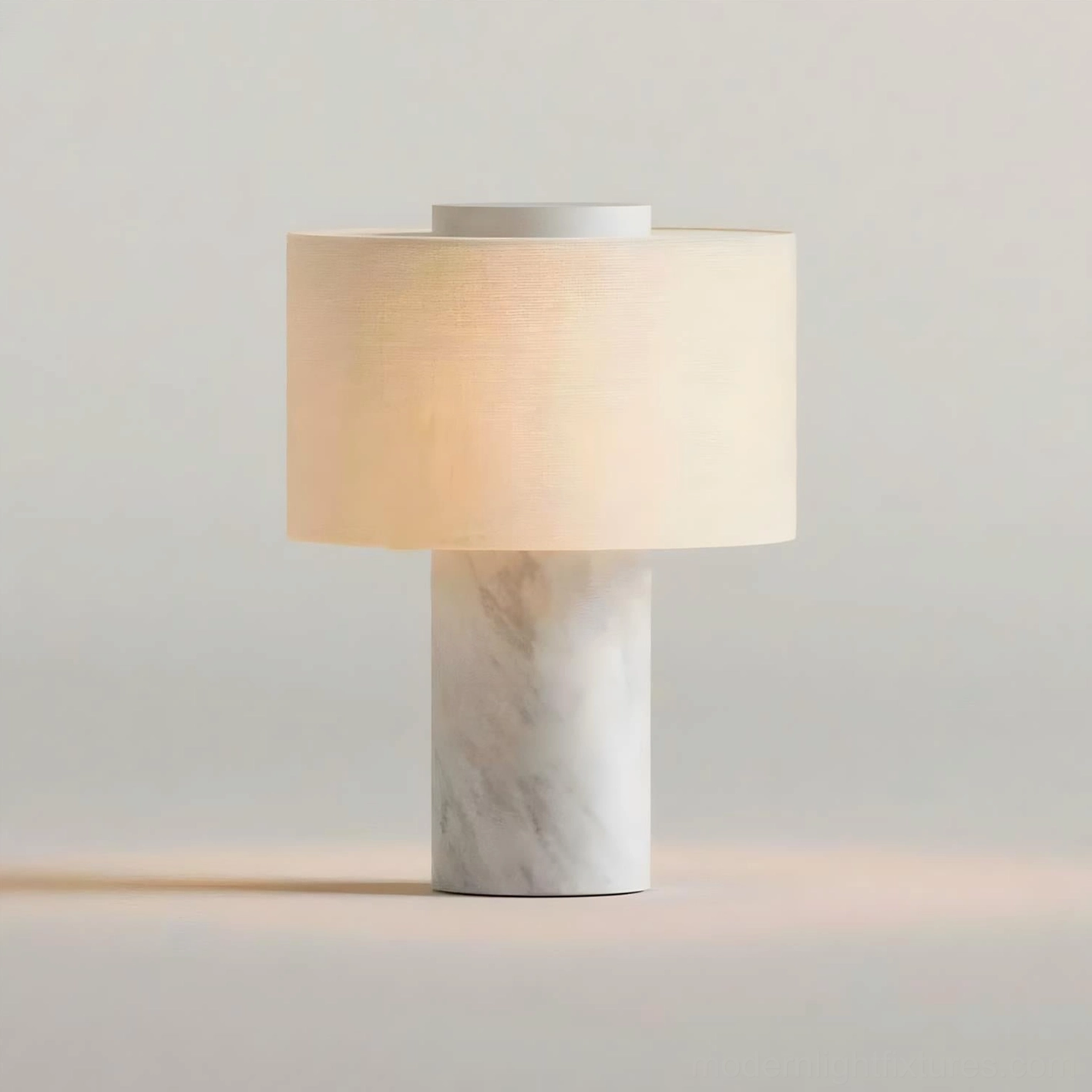 White marble Sediment table lamp with white fabric shade on pure white studio background featuring direct front view