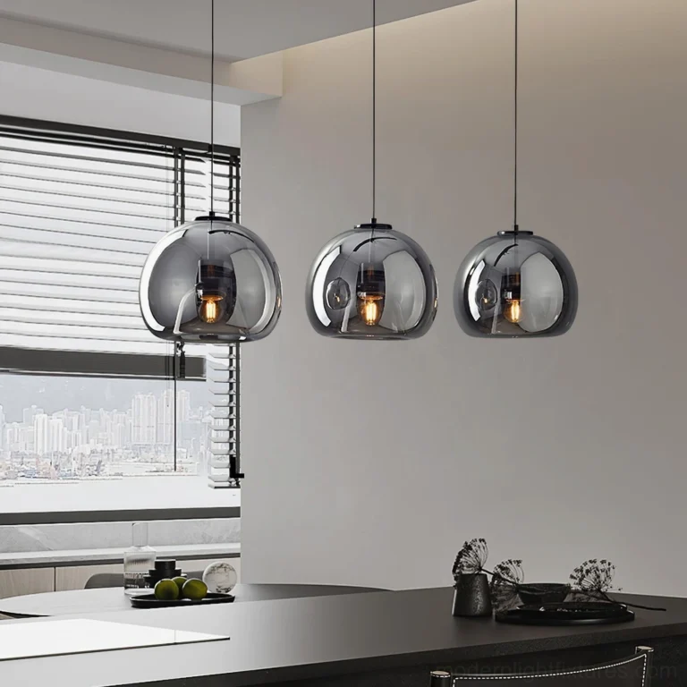 Sedona 3-head linear pendant lights above black kitchen island in Nordic minimalist style home