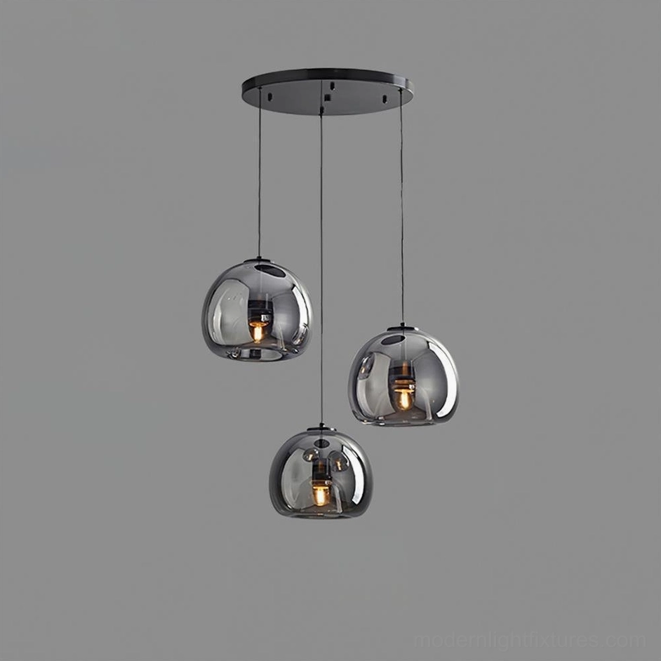 Sedona 3-head round canopy pendant light in bright dining room with natural light