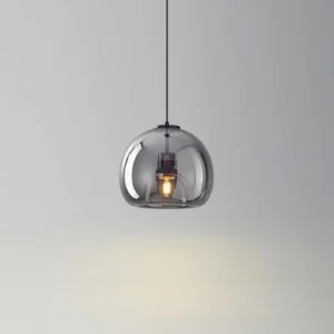 Sedona pendant light casting warm amber glow on interior wall, demonstrating ambient lighting effects