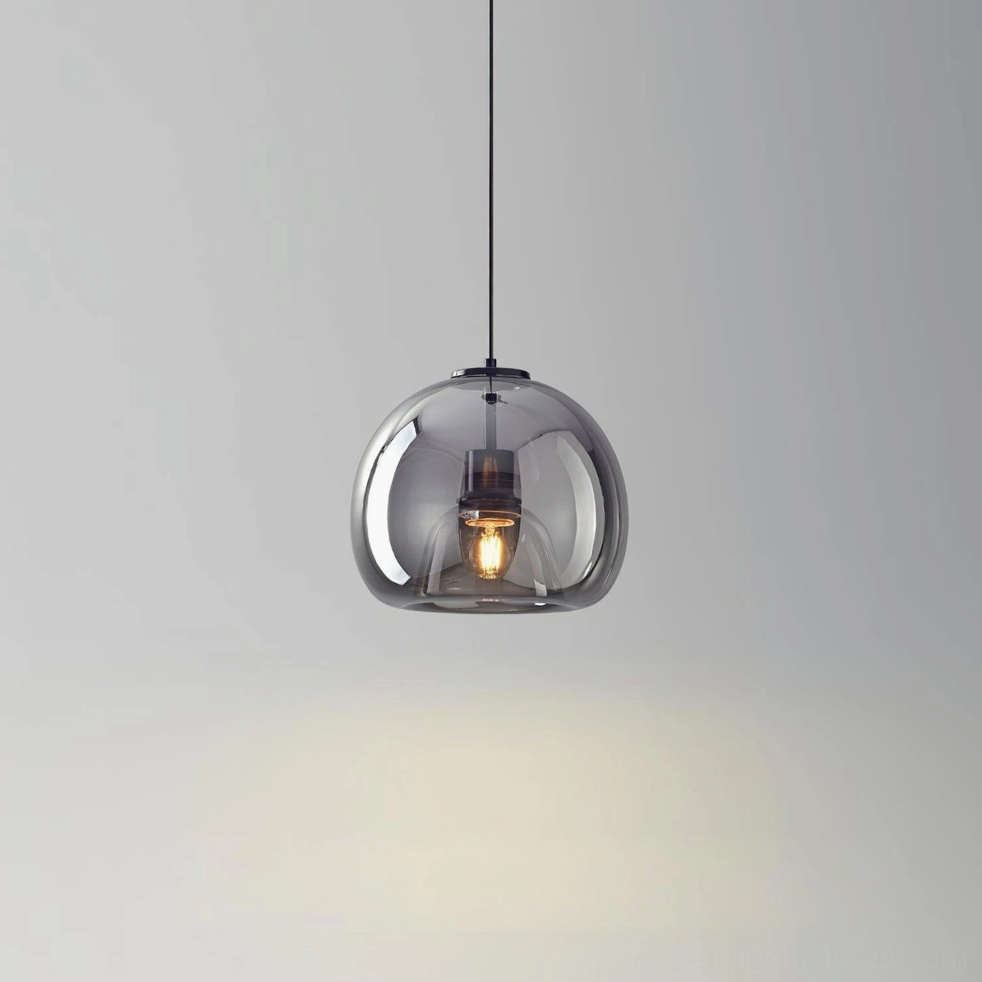 Sedona pendant light casting warm amber glow on interior wall, demonstrating ambient lighting effects