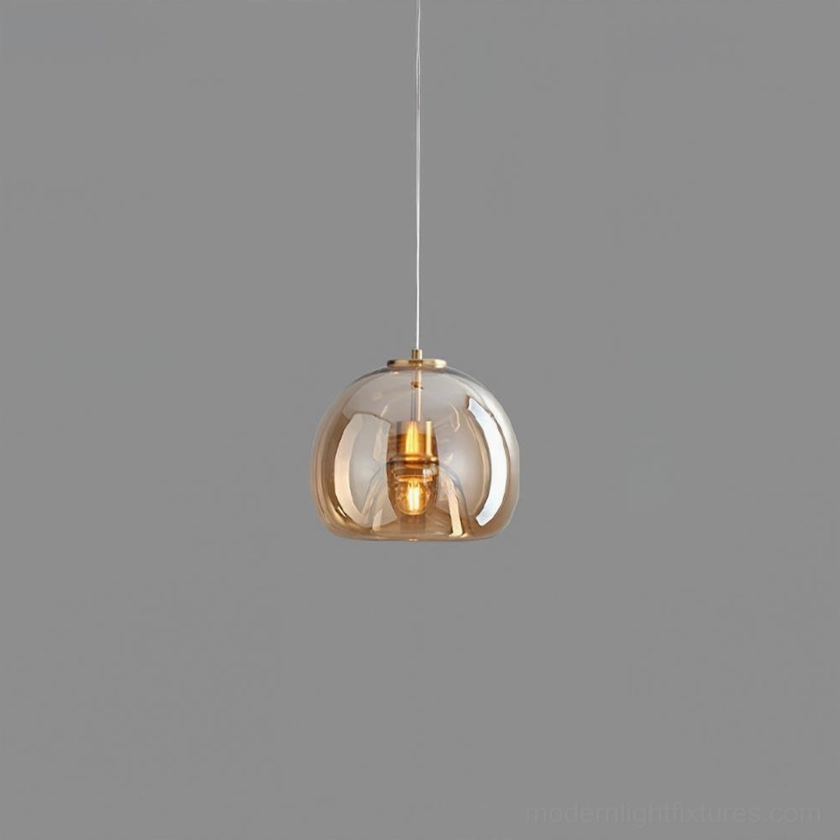 Sedona single cognac smoked glass pendant light showing warm glow characteristics